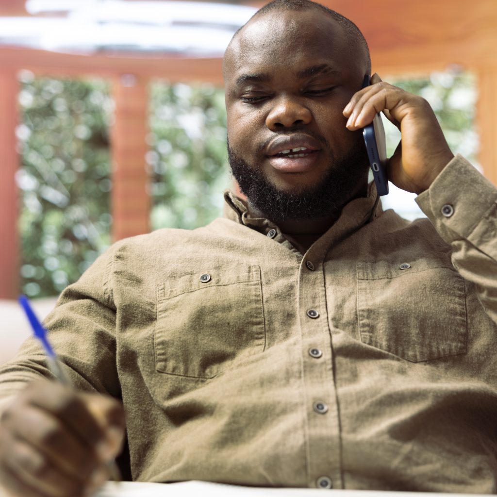 Business manager calling his investment board from home office to increase budget and funds for an expansion project. Entrepreneur negotiating with people on remote phone call.